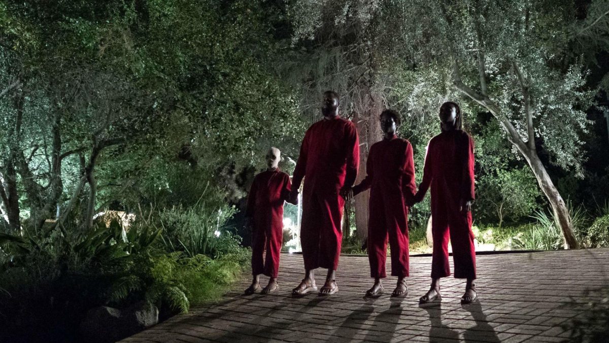 Evan Alex as Jason Wilson/Pluto, Winston Duke as Gabe Wilson/Abraham, Lupita Nyong’o as Adelaide Wilson/Red, and Shahadi Wright Joseph as Sora Wilson/Umbrae in director Jordan Peele’s “Us.” Cr: Universal Pictures