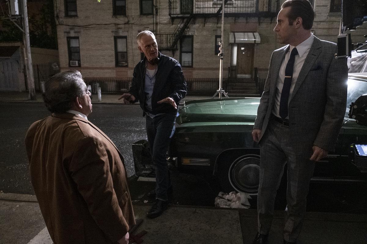 Joey Coco Diaz, director Alan Taylor and Alessandro Nivola on the set of “The Many Saints of Newark.” Cr: Barry Wetcher/Warner Bros. Pictures