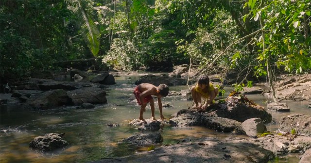 Uru-eu-wau-wau children play in a stream next to their village. Cr: Alex Pritz/Amazon Land Documentary